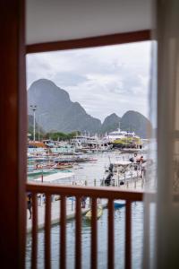 a view from a window of a marina with boats at Upper Bliss Homestay in El Nido