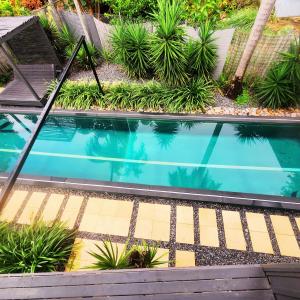 Foto dalla galleria di 4 BDR Airconditioned Tropical Escape, Lap Pool & Parking for Caravans, Boats and Trailers a Casuarina