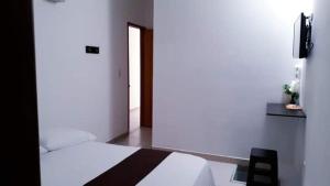 Postel nebo postele na pokoji v ubytování Hotel Tramonti