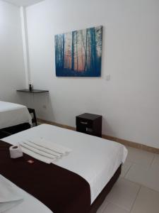 Postel nebo postele na pokoji v ubytování Hotel Tramonti