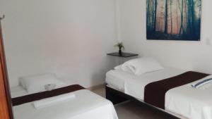 Postel nebo postele na pokoji v ubytování Hotel Tramonti