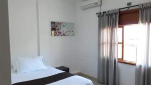 Postel nebo postele na pokoji v ubytování Hotel Tramonti