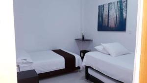 Postel nebo postele na pokoji v ubytování Hotel Tramonti