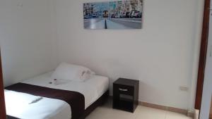 Postel nebo postele na pokoji v ubytování Hotel Tramonti