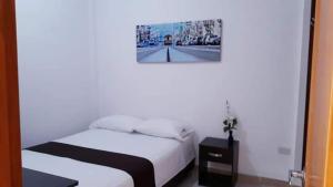 Postel nebo postele na pokoji v ubytování Hotel Tramonti
