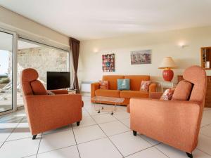 a living room with two couches and a tv at Carnac - Appartement 2 pièces - 4 pers - 65m² - Wifi - FR-1-477-258 in Carnac