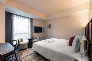 Postel nebo postele na pokoji v ubytování The Gate Hotel Yokohama by Hulic + 37 fotografií