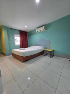 Postel nebo postele na pokoji v ubytování City Inn Udonthani