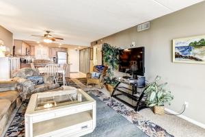 a living room with a couch and a table at Fresh Oceanfront Condo in Fernandina Beach +18 photos