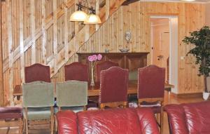 a dining room with a table and chairs at Stunning Home In Ljungby With Wifi in Bolmstad