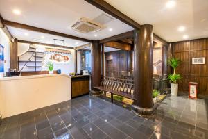 a restaurant with a bench in a room at Huangshan Chuyuyuan Manju Homestay in Huangshan