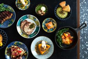 a bunch of plates of food on a table at Canopy By Hilton Osaka Umeda in Osaka +69 photos
