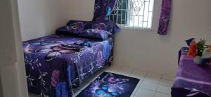 Postel nebo postele na pokoji v ubytování Multiple Holiday Rooms in Port Morant St Thomas Jamaica