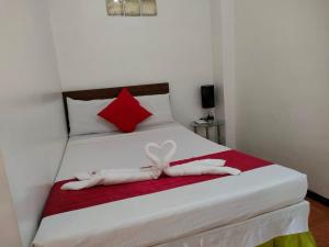 Voodi või voodid majutusasutuse Axis Pension Hotel toas