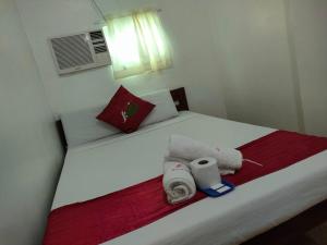 Voodi või voodid majutusasutuse Axis Pension Hotel toas