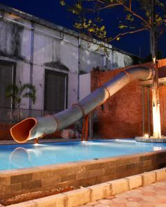 a pipe in a swimming pool at night at Swiss-Belexpress Rest Area KM 260B in Bulakamba