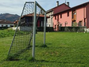 a soccer goal in a yard with a house at El Campo de Petra in Grado +41 photos
