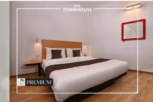 Postel nebo postele na pokoji v ubytování Townhouse Singapore Mall