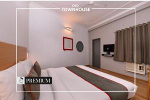 Postel nebo postele na pokoji v ubytování Townhouse Singapore Mall