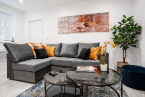 a living room with a couch and a table at Brighton Apt - 2 Bedroom Free Wi-Fi & Parking in Wallasey