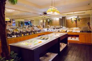 a restaurant with a large buffet line with food at Ohotel in Taichung