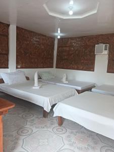 Postel nebo postele na pokoji v ubytování Magindara Guesthouse