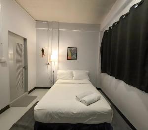 Ένα ή περισσότερα κρεβάτια σε δωμάτιο στο GO INN BTS Ari - BTS Ari Station