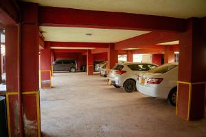 an empty garage with cars parked in it at Micasa Homes BnB D6 in Limuru