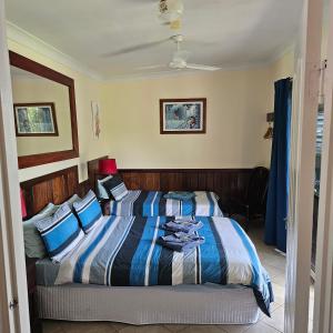 Voodi või voodid majutusasutuse Daintree Riverview Lodges toas