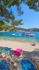 a beach with a group of boats in the water at Mobile home Tortuga in Drage