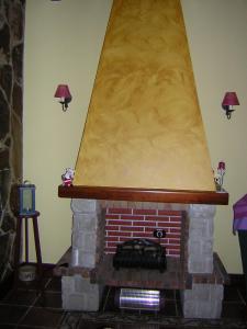 a brick fireplace with awning on top of it at Villa Caya in La Orotava