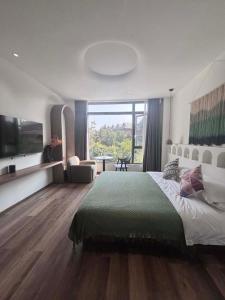 Xishuangbanna Verdant House Resort Hotel 객실 침대