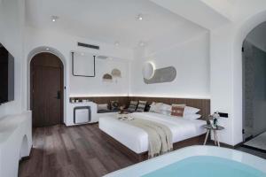 Xishuangbanna Verdant House Resort Hotel 객실 침대