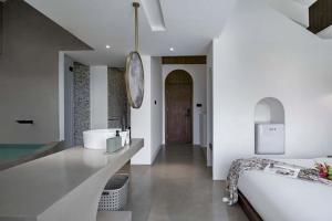 Xishuangbanna Verdant House Resort Hotel 객실 침대