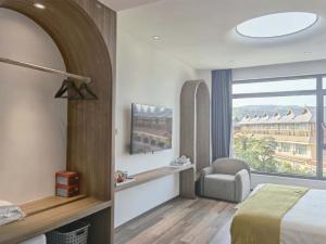 Xishuangbanna Verdant House Resort Hotel 객실 침대