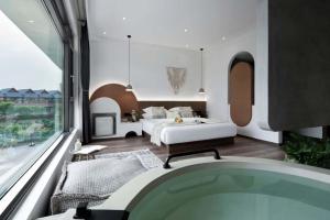 Xishuangbanna Verdant House Resort Hotel 객실 침대