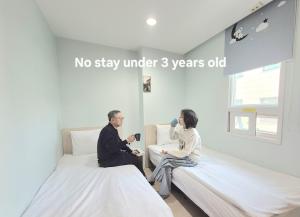 Cama ou camas em um quarto em Hostel Tommy Renewal 2025