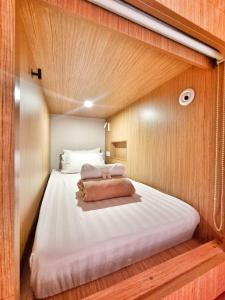 Postel nebo postele na pokoji v ubytování Moonstar Cebu Hotel + 8 fotografií