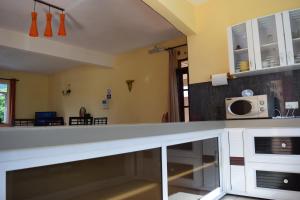Kuchyň nebo kuchyňský kout v ubytování Baywatch Apartment