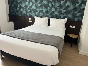 Postel nebo postele na pokoji v ubytování Hotel Au Spatial