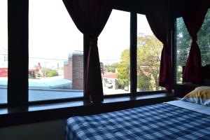 Voodi või voodid majutusasutuse Hotel Columbus toas
