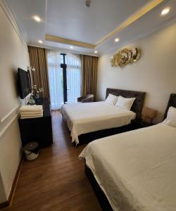 Ένα ή περισσότερα κρεβάτια σε δωμάτιο στο BREAKING DAWN- TAEYANG Hotel Phú Quốc