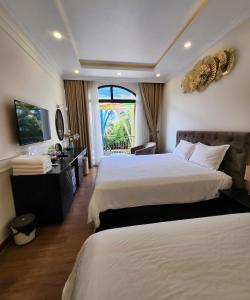 Ένα ή περισσότερα κρεβάτια σε δωμάτιο στο BREAKING DAWN- TAEYANG Hotel Phú Quốc