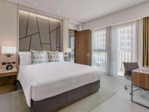 dusitD2 Davao客房内的一张或多张床位