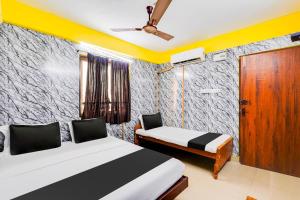 Voodi või voodid majutusasutuse Super Hotel O Heritage Town Formerly Vasavi toas