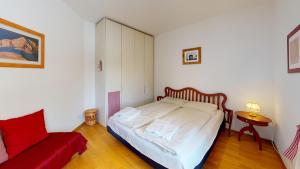 Postel nebo postele na pokoji v ubytování Apartment Domiziana