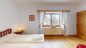 Postel nebo postele na pokoji v ubytování Apartment Domiziana + 3 fotografie