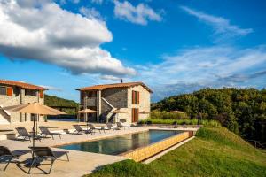an image of a villa with a swimming pool at Tenuta La Farneta in Casole dʼElsa