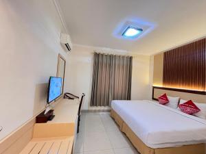 Postel nebo postele na pokoji v ubytování Hotel Cepu Indah 1 + 13 fotografií