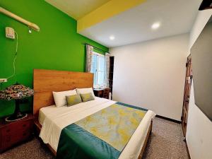 Ein Bett oder Betten in einem Zimmer der Unterkunft Village Hostel